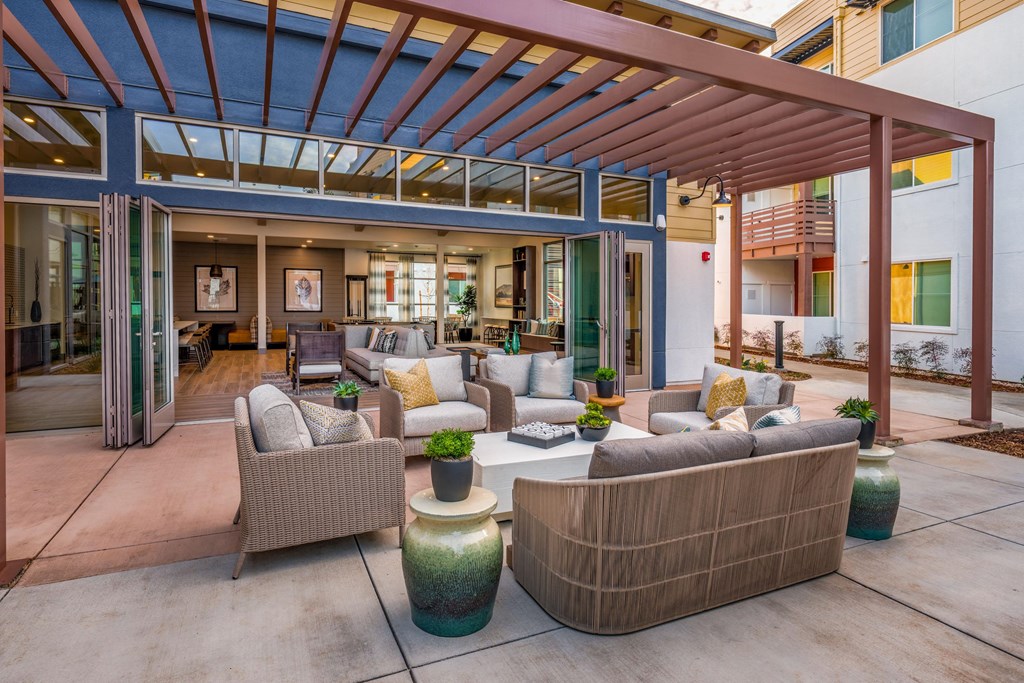 Aurora Apartments outdoor seating area with canopy