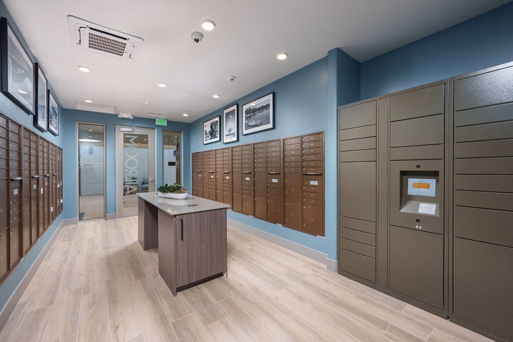 Aurora Apartments mailroom with parcel lockers