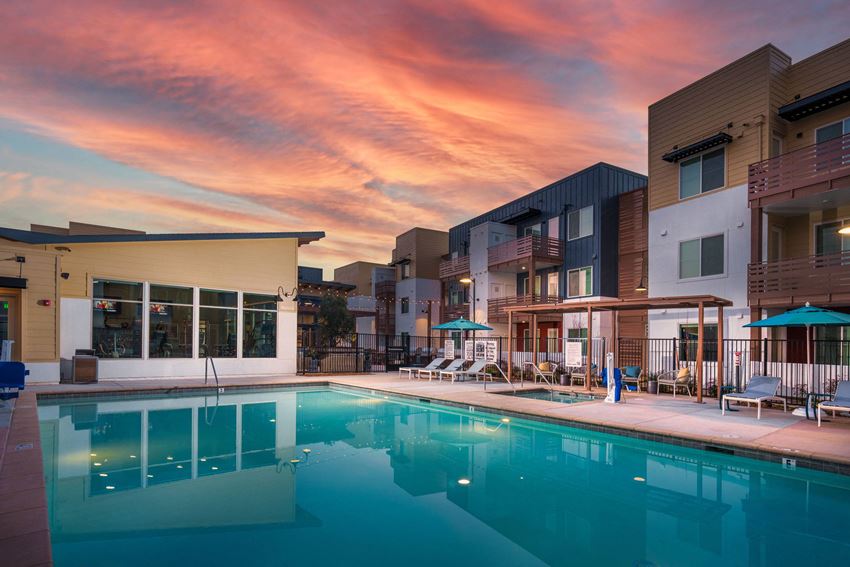 Aurora Apartments pool area with seating Aurora Apartments pool area with seating