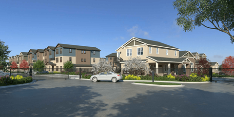 A large house with a car parked in front.