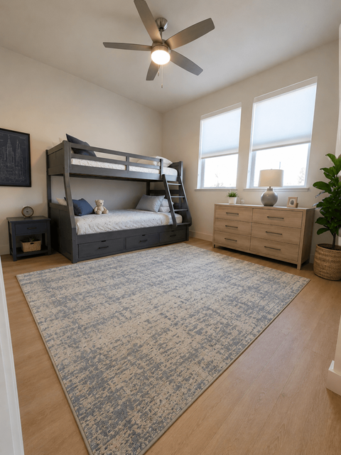 A bedroom with a bunk bed and a dresser.