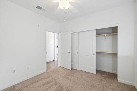A room with white walls and a carpeted floor.