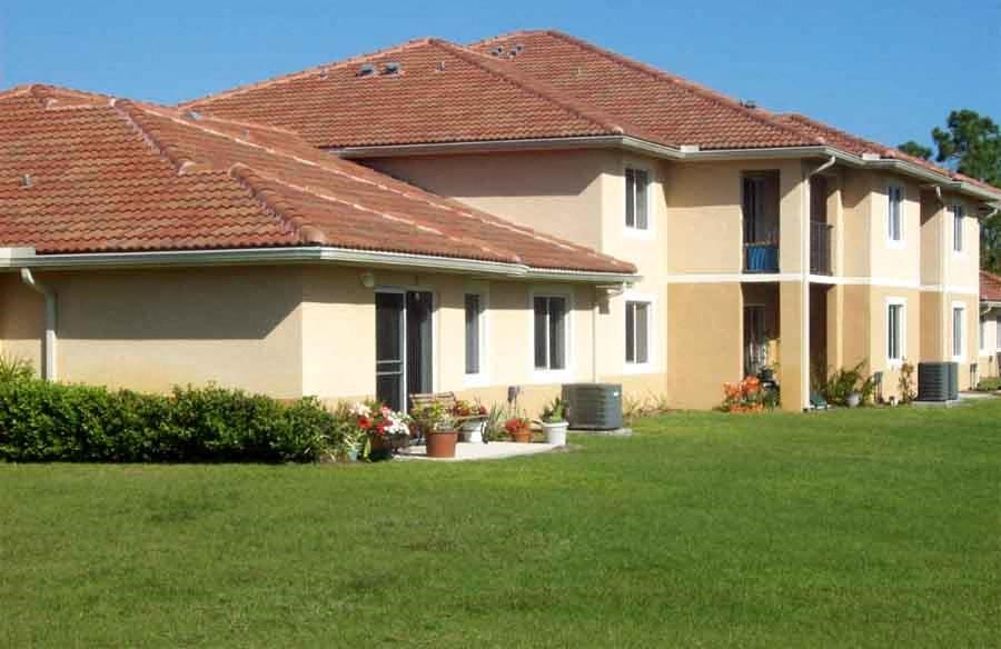 a house with a green lawn in front of it