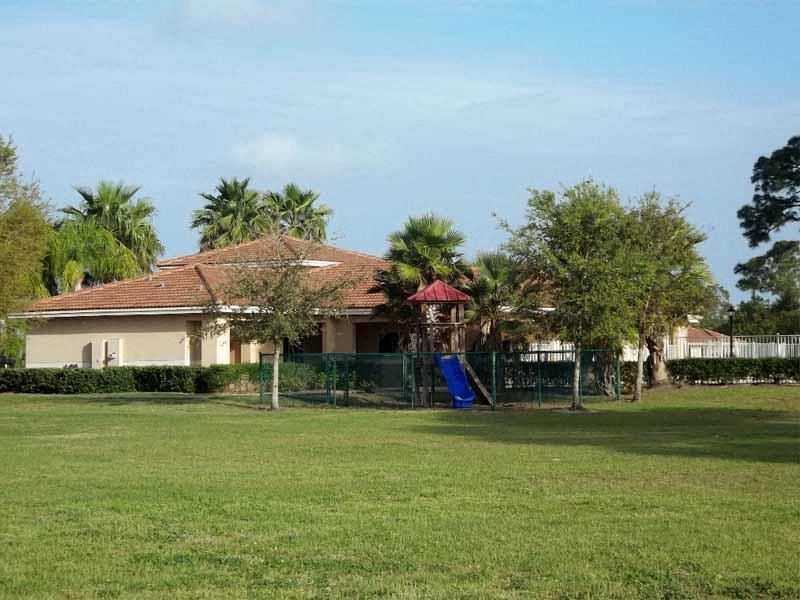 a house with a blue slide in a yard