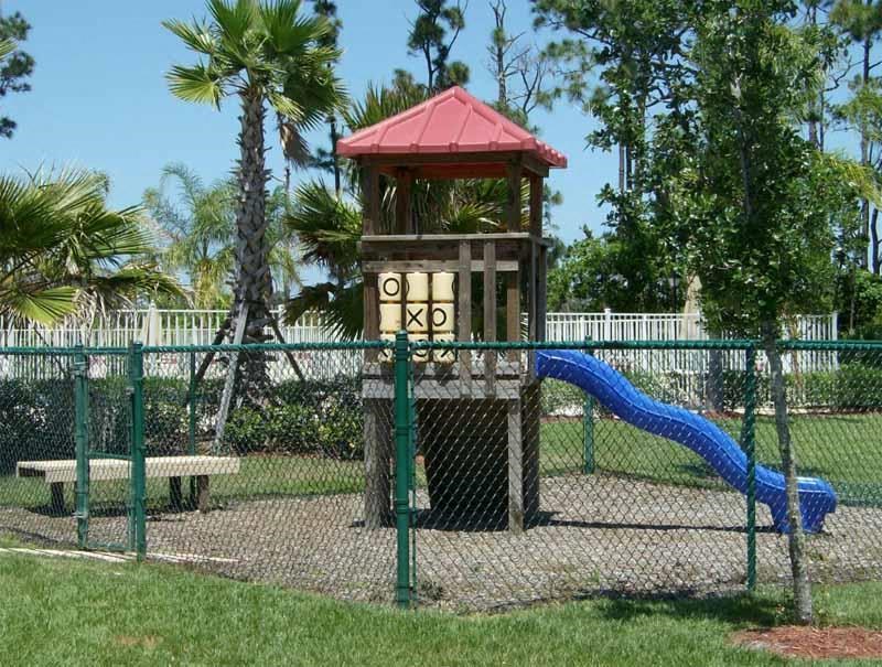 a playground with a slide and a tower