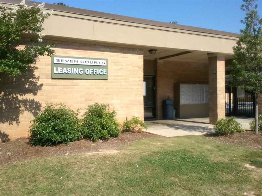 a building with a leasing office on the side of it