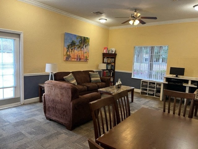 a living room and dining room with a couch and a table