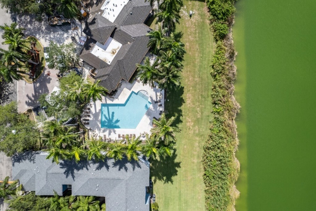 arial view of a house with a swimming pool