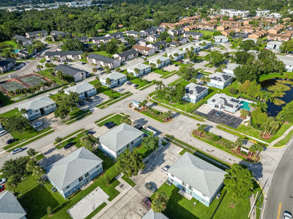 an aerial view of a neighborhood with houses and trees
