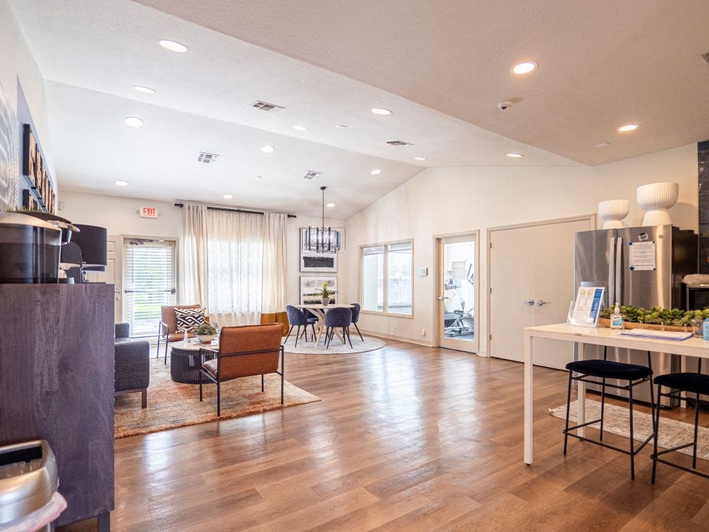 a living room with a kitchen and a dining room