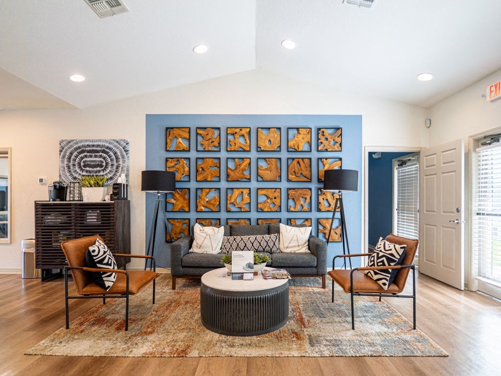 a living room with a blue wall and furniture