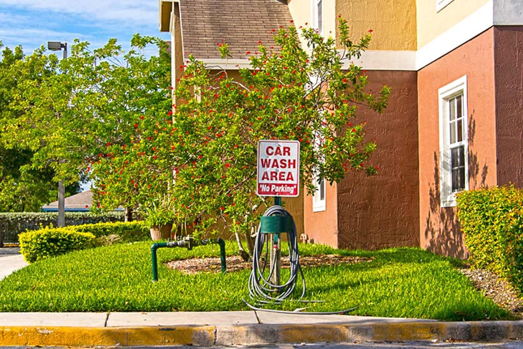a car wash area sign in front of a building