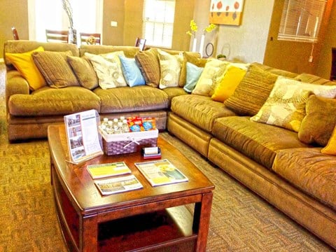 a living room with couches and a coffee table