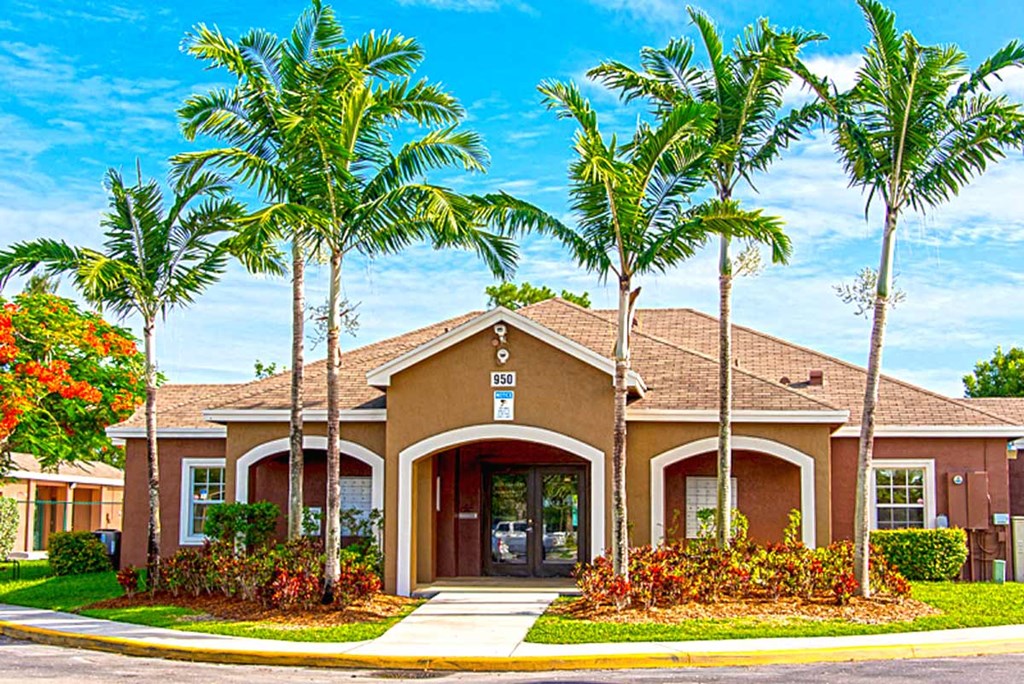 a house with palm trees in front of it