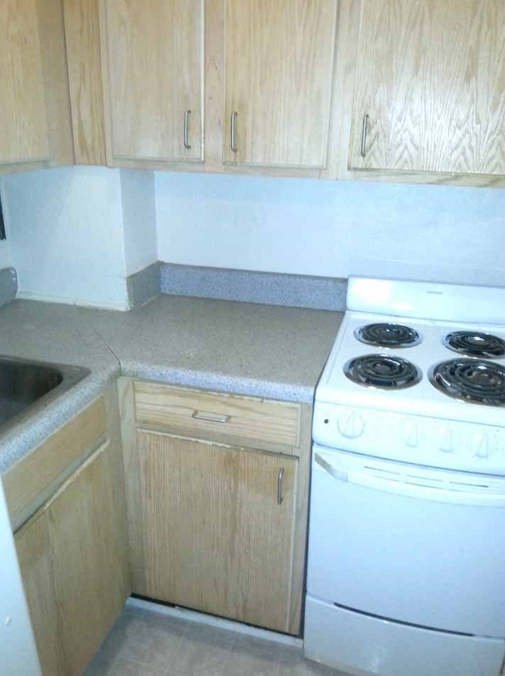 a kitchen with a stove and a sink