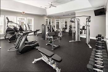 a gym with weights and cardio equipment at Abberly Green Apartment Homes by HHHunt, Mooresville, NC 28117