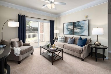 Living Room With Balcony at Abberly Green Apartment Homes, Mooresville, North Carolina