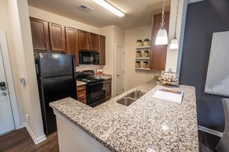 Granite Kitchen Worktops Granite Kitchen Worktops at Abberly CenterPointe Apartment Homes by HHHunt, Midlothian, VA - Photo Gallery