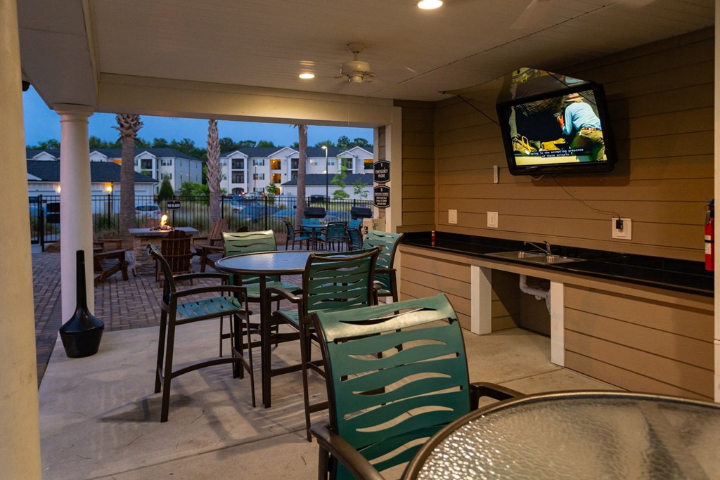 Picnic Grilling Area with TV at Abberly Crossing Apartment Homes by HHHunt, Ladson, 29456