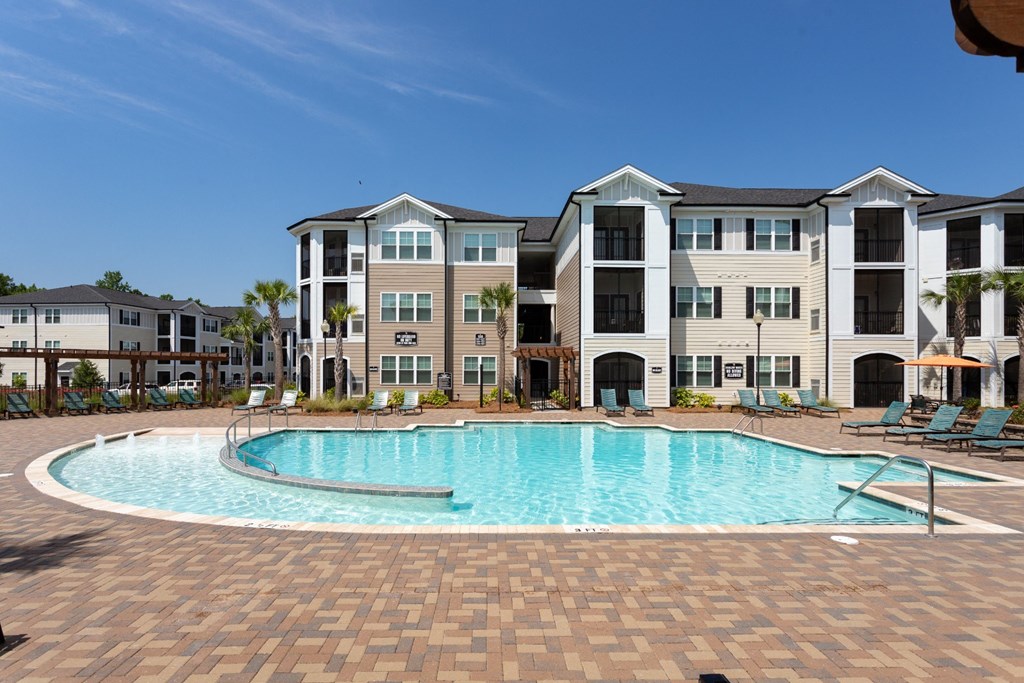 Relaxing Area by the Pool at Abberly Crossing Apartment Homes by HHHunt, Ladson