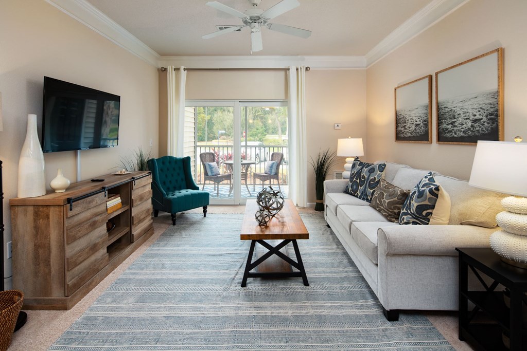 Living Room With Private Balcony at Abberly Pointe Apartment Homes by HHHunt, Beaufort, 29935