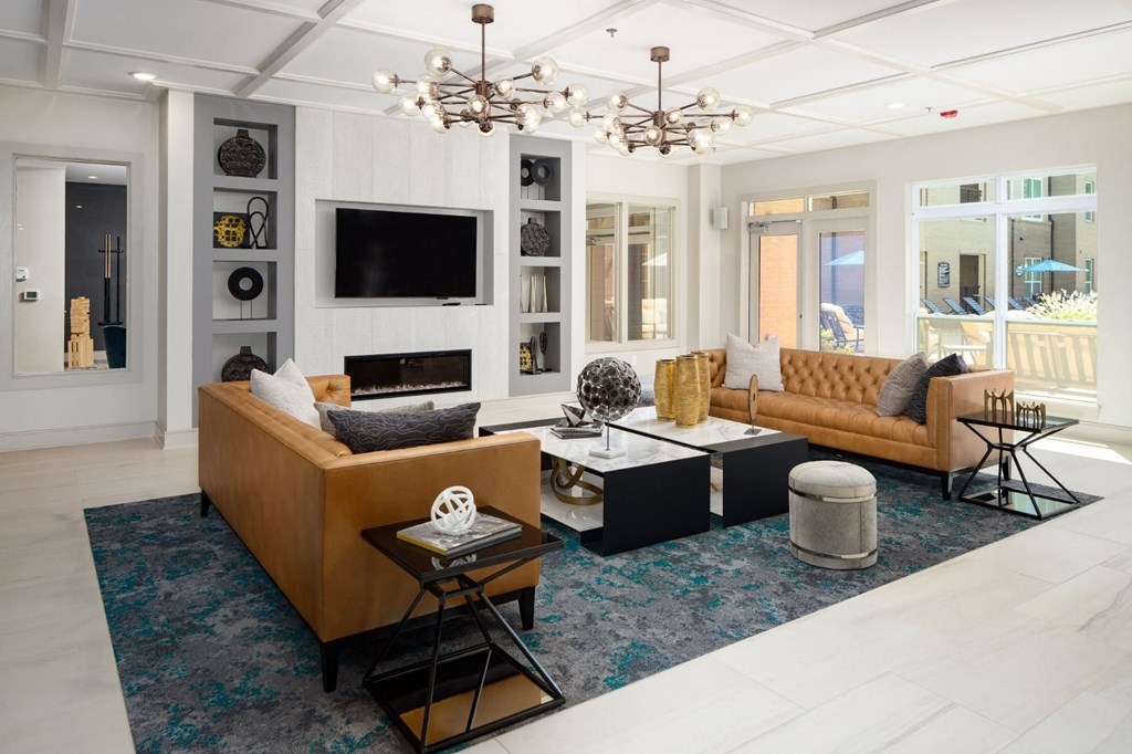 Clubroom With Smart Tv And Fireplace at Abberly Solaire Apartment Homes, Garner, NC, 27529