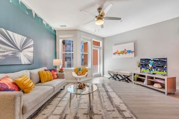 Living Area With TV at Abberly Noda Vista Apartment Homes, Charlotte, NC, 28206