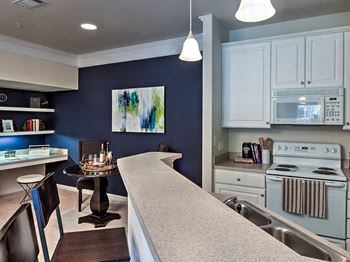 Living room and kitchen open floorplan at Abberly Green Apartment Homes by HHHunt, Mooresville