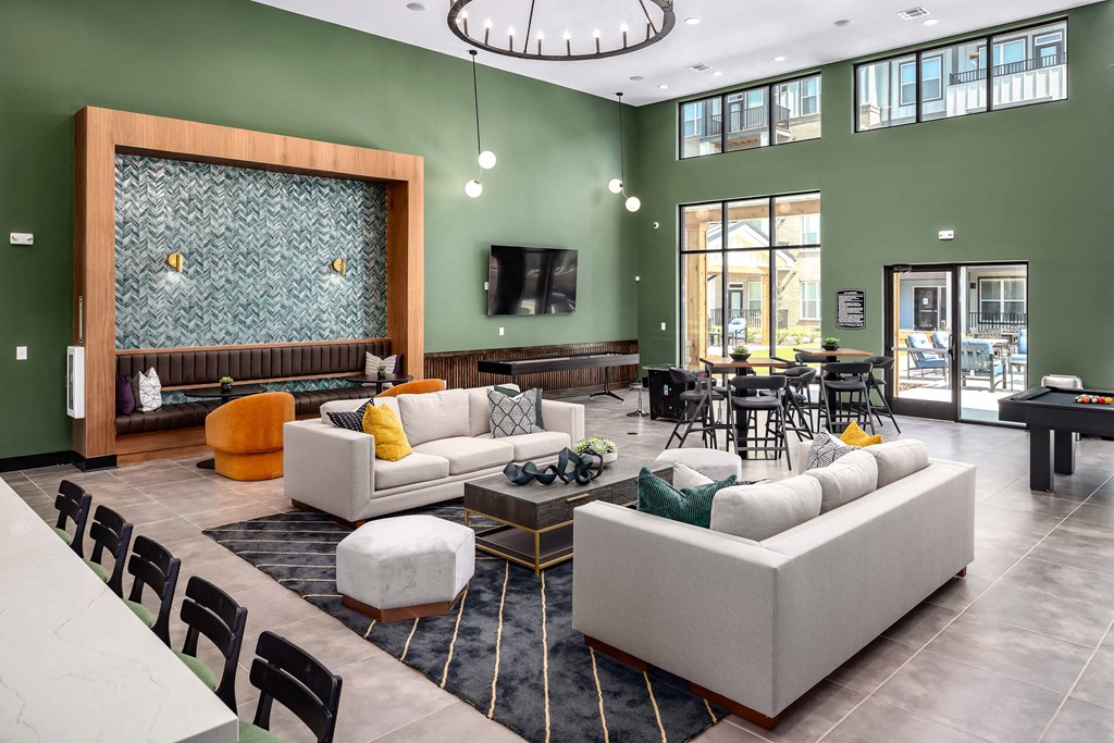 a living room filled with furniture and a large window