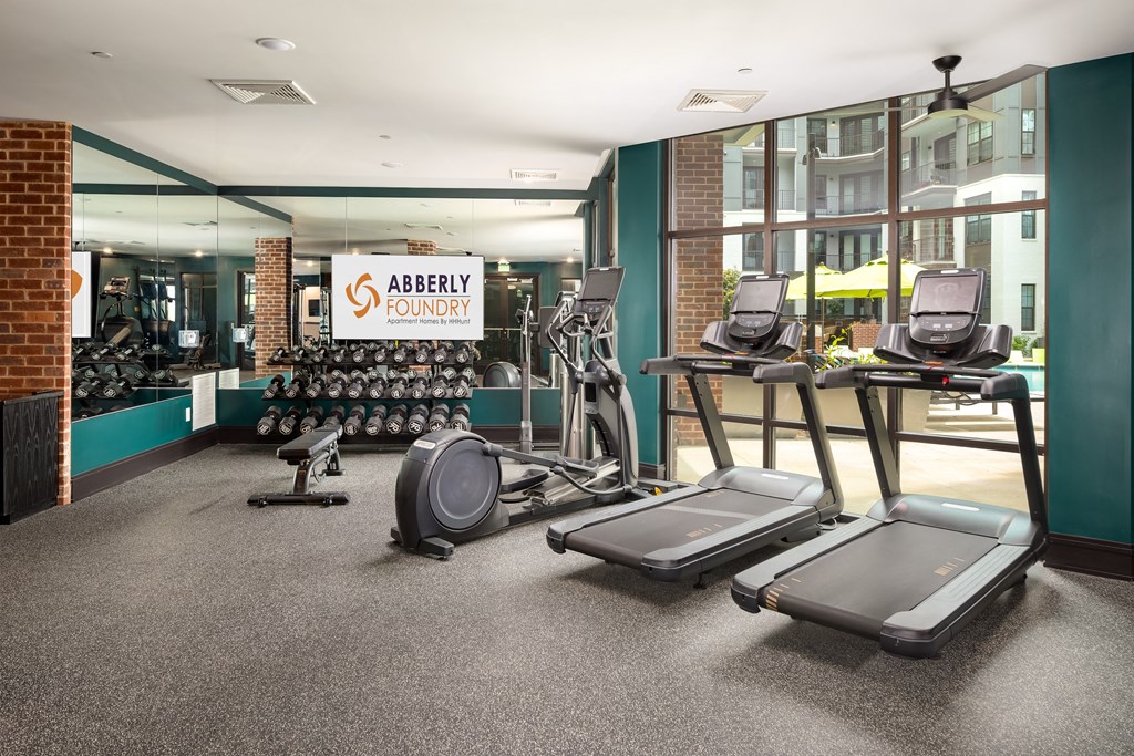 a gym with treadmills and other exercise equipment at Abberly Foundry Apartment Homes, Nashville