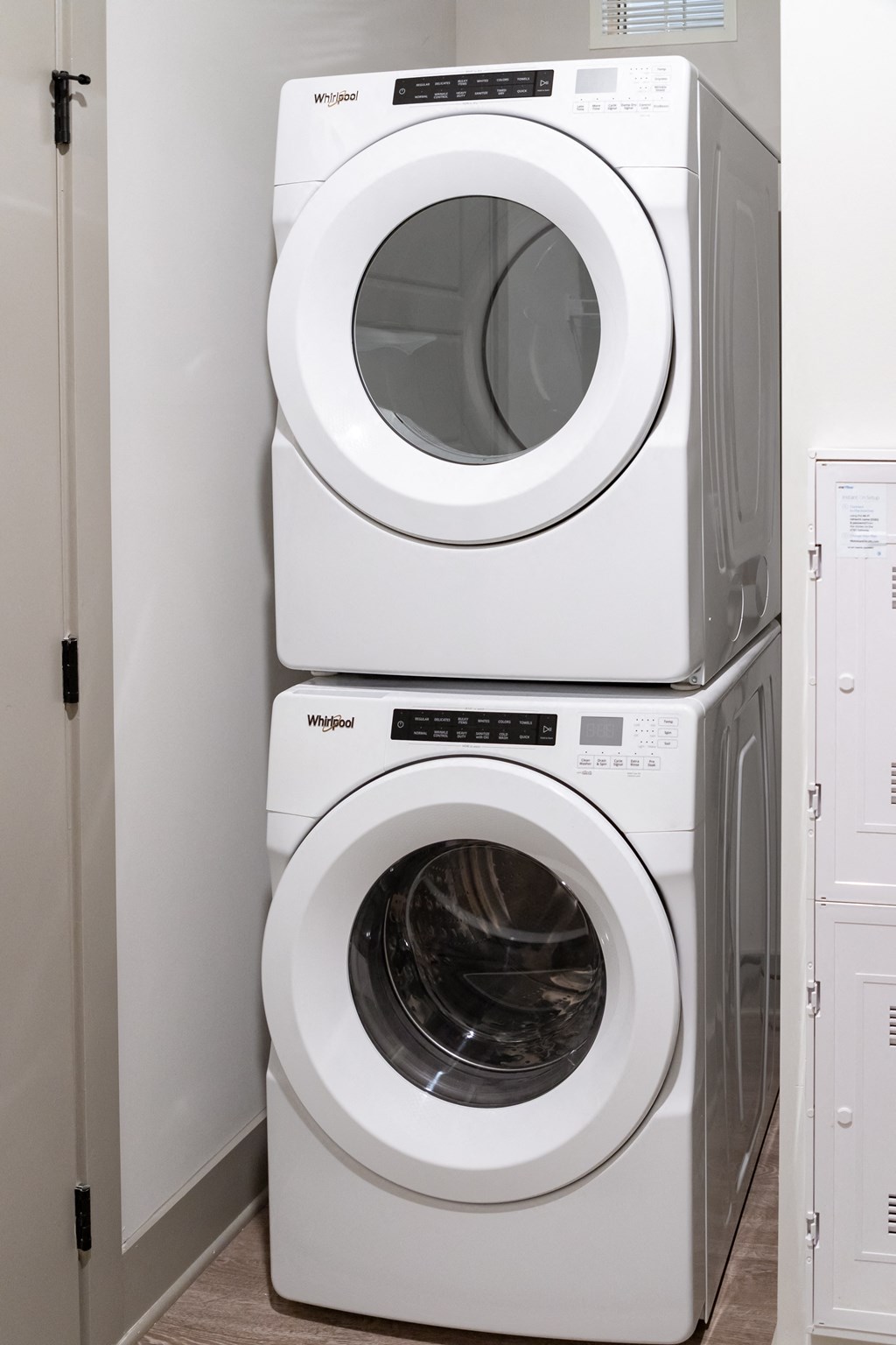 a washer and dryer sit next to each other in a laundry room at Abberly Foundry Apartment Homes, Nashville, 37203