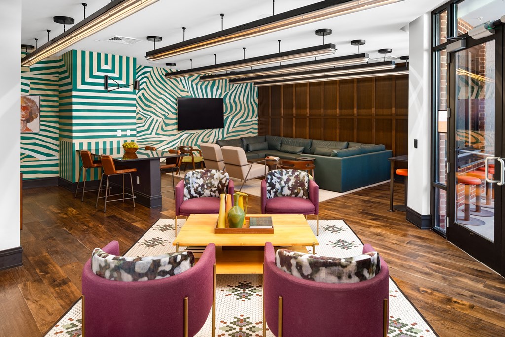 a room with couches chairs and a table at Abberly Foundry Apartment Homes, Nashville