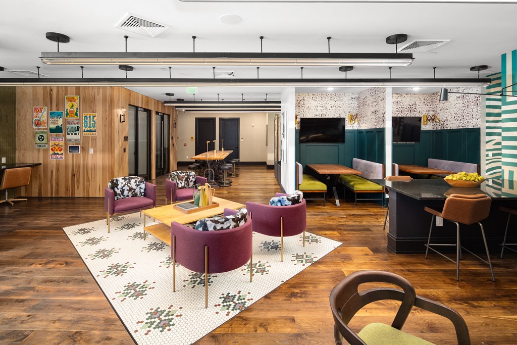 a room filled with furniture and a large window at Abberly Foundry Apartment Homes, Nashville, Tennessee