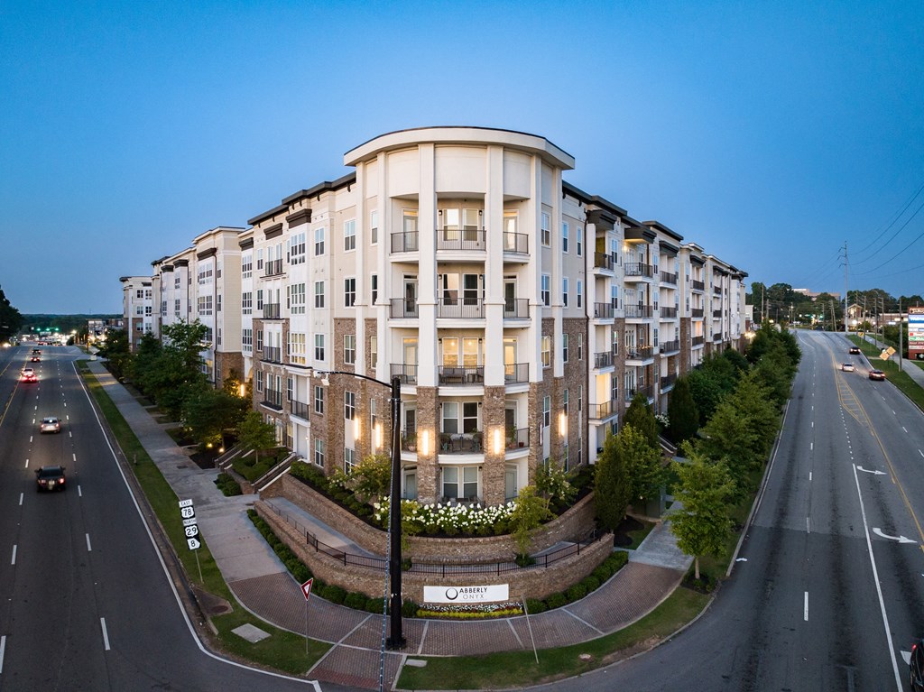 an aerial view of a large apartment building at dusk  at Abberly Onyx Apartment Homes, Decatur, 30033