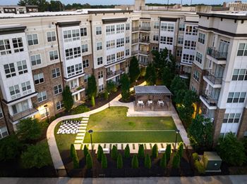 an aerial view of a building with a grassy area in front of it  at Abberly Onyx Apartment Homes, Decatur, GA