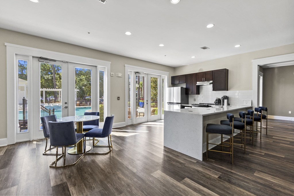 a living room with a kitchen at West Ashley Apartment Homes, Charleston