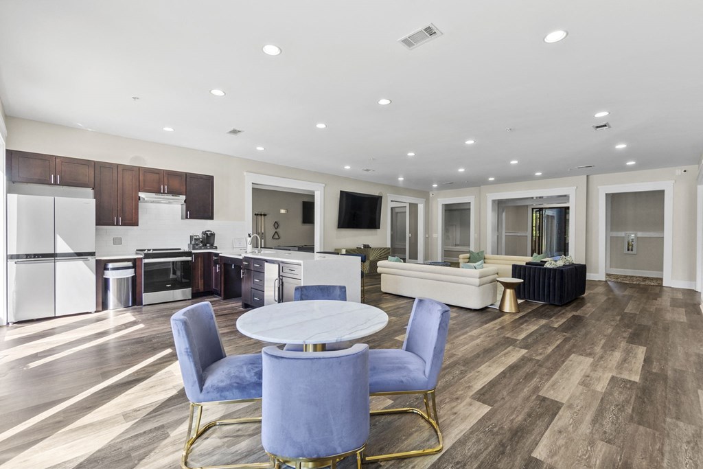 a living room with a kitchen at West Ashley Apartment Homes, South Carolina