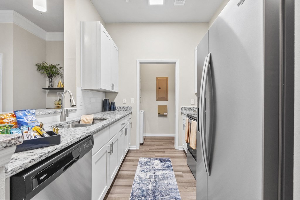 a kitchen with white cabinets at West Ashley Apartment Homes, Charleston