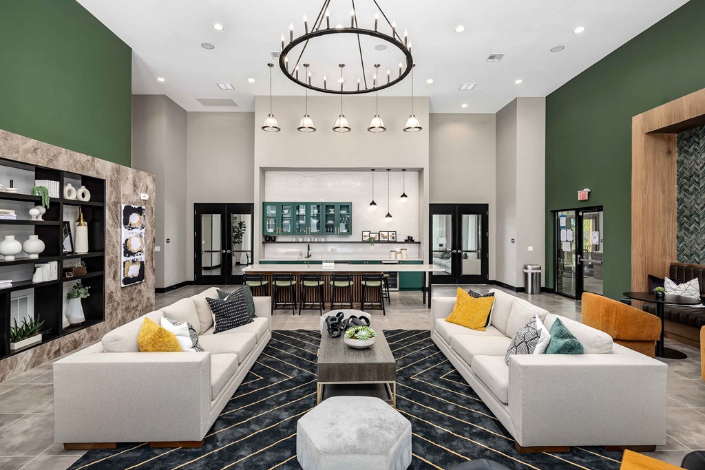 a living room with couches and a coffee table at Abberly Liberty Crossing Apartment Homes, Charlotte