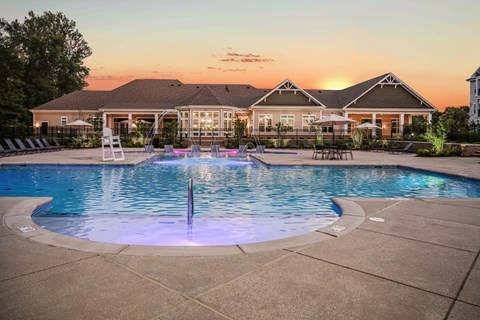 A large house with a pool in the backyard.