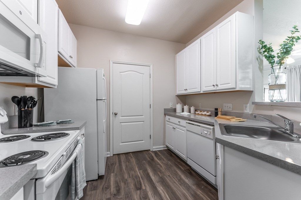 a kitchen with white cabinets and stainless steel appliances at Abberly Crest Apartment Homes, Maryland, 20653