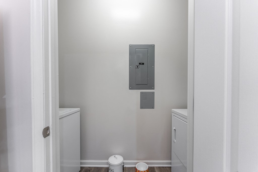 a small laundry room with a washer and dryer at Abberly Crest Apartment Homes, Lexington Park, MD, 20653