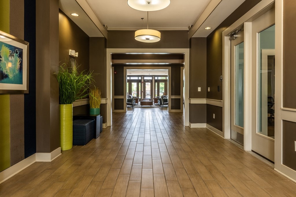 a large hallway with wood floors and brown walls at Abberly Crest Apartment Homes, Lexington Park, 20653