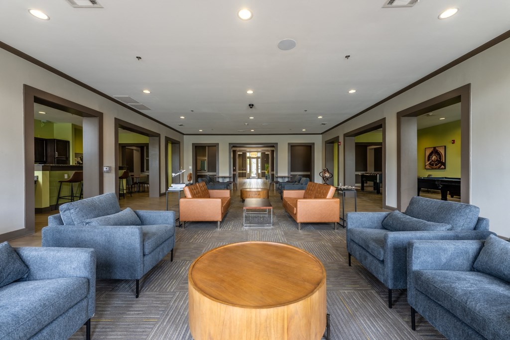 a lounge area with couches chairs and a coffee table at Abberly Crest Apartment Homes, Lexington Park, MD