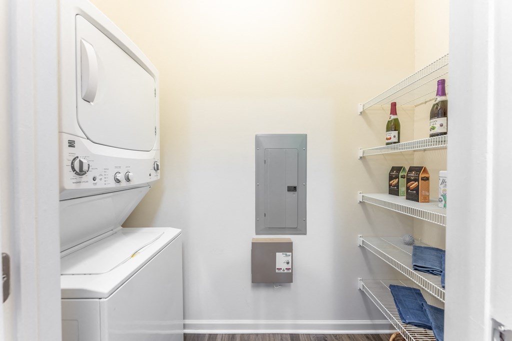 a washer and dryer in a laundry room at Abberly Crest Apartment Homes, Lexington Park, Maryland