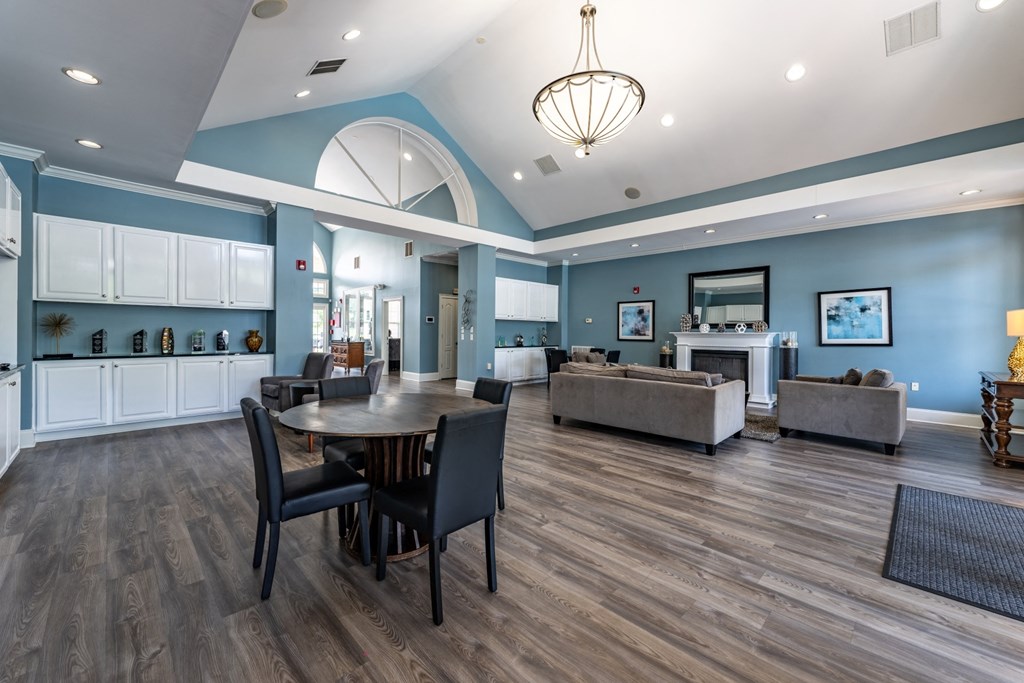 the reserve at bucklin hill clubhouse with table and chairs at Abberly Crest Apartment Homes, Lexington Park, Maryland