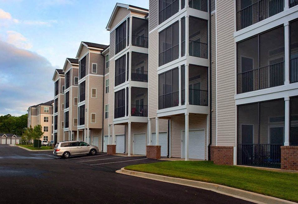 a car parked in front of an apartment building  at Abberly Crest Apartment Homes, Lexington Park, Maryland