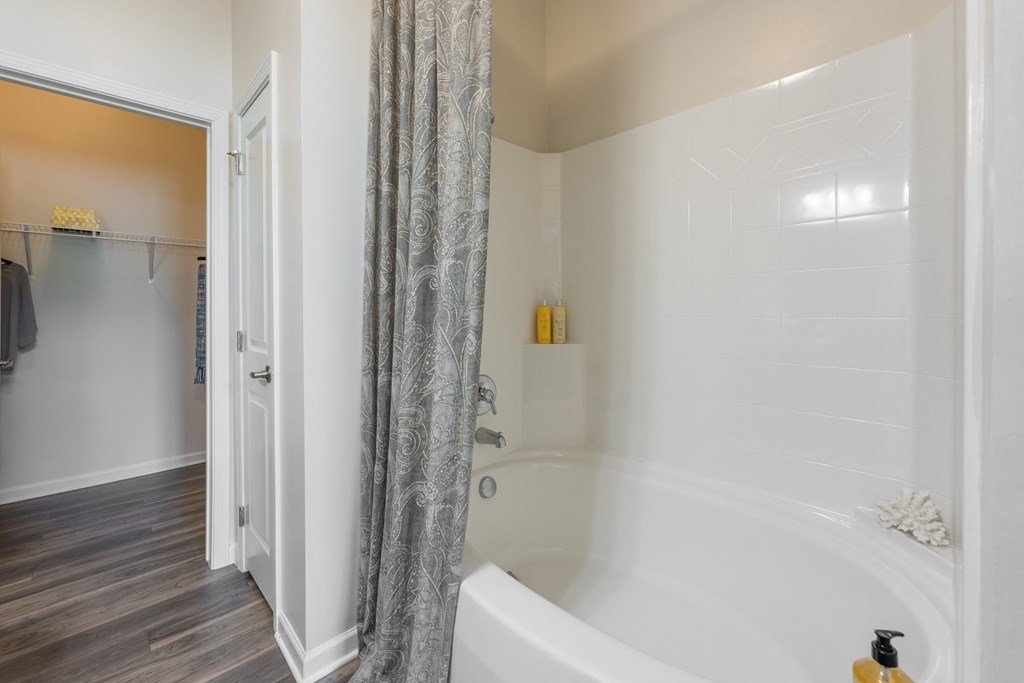 a bathroom with a shower and a bathtub at Abberly Crest Apartment Homes, Lexington Park, Maryland