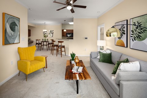 our apartments offer a living room with a couch a coffee table and a dining room table