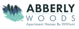 a logo of abbey woods against a green background